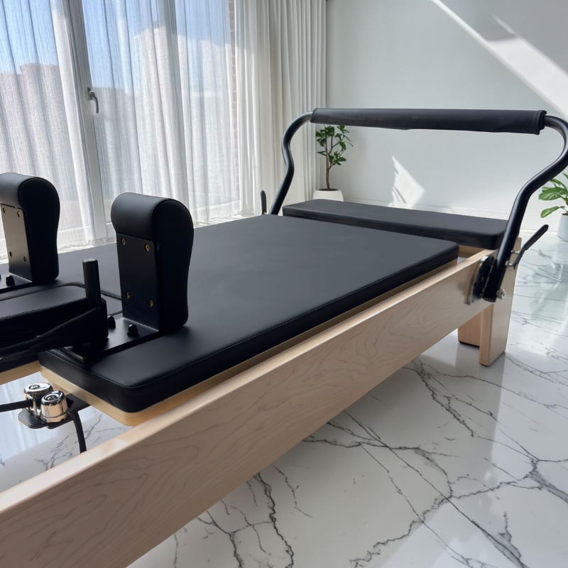 Side view of carriage on Milaron Maple V3 Pilates Reformer for Studio