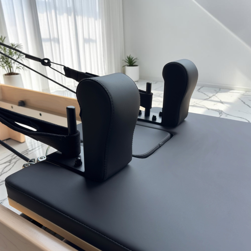 Front view of shoulder blocks on Milaron Maple V3 Studio Reformer Pilates Machine