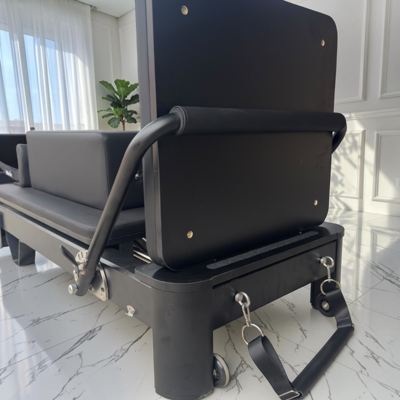 Front view of Milaron Pearl V3 Portable Pilates Reformer in Noir with jumpboard on