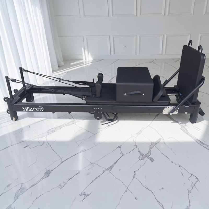Side view without standing platform of Milaron Pearl V3 Foldable Pilates Reformer Machine in Noir