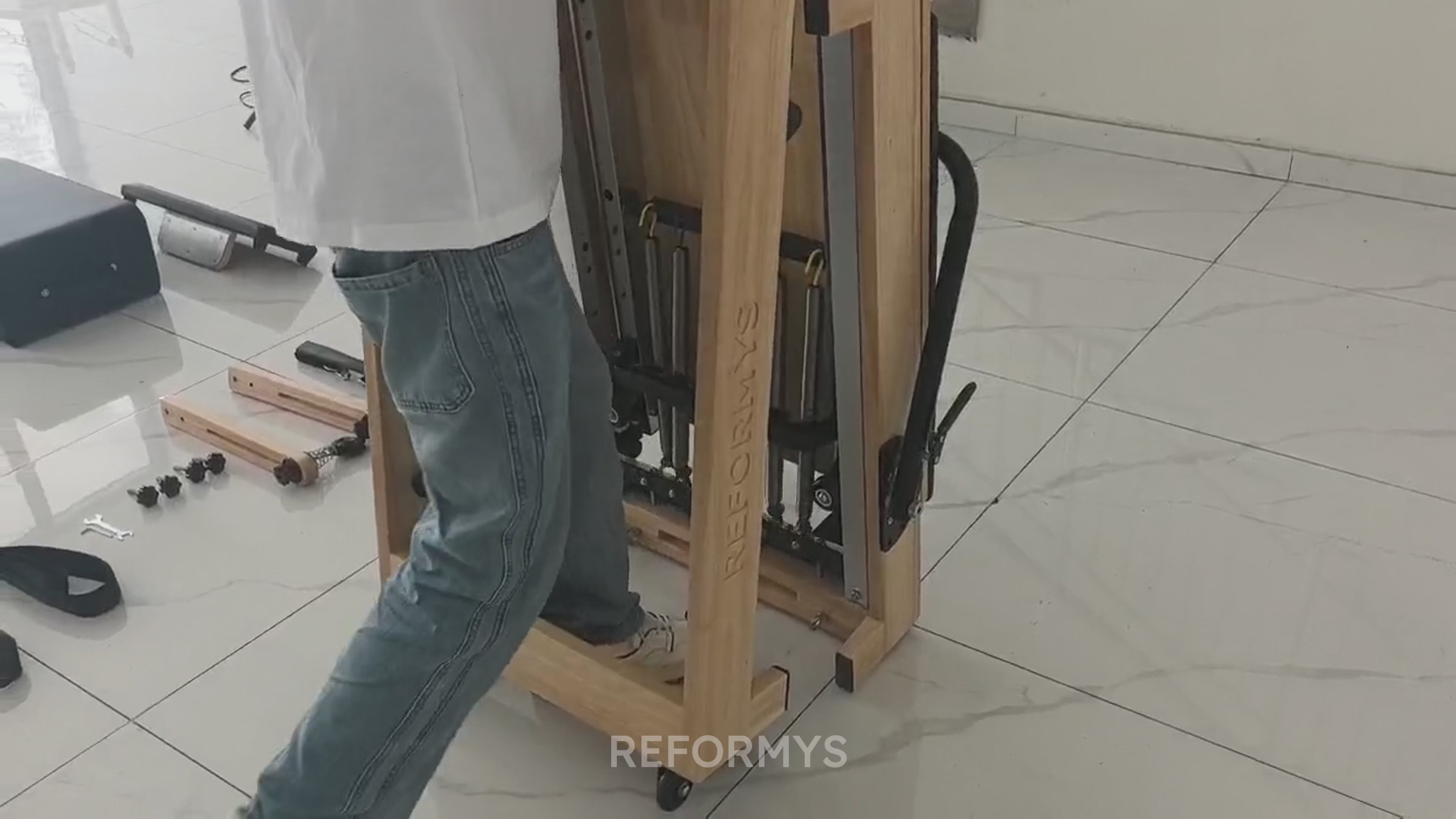 Video demonstration of how easy it is fold and unfold the Reformys Cloud Assisted Folding Pilates Reformer thanks to its hydraulic dampers.