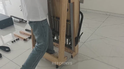 Video demonstration of how easy it is fold and unfold the Reformys Cloud Assisted Folding Pilates Reformer thanks to its hydraulic dampers.