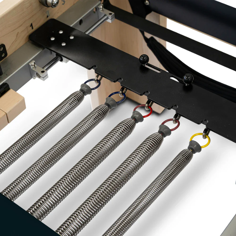 Close-up of the attached springs on Reeplex Cadillac Pilates Reformer with Full Trapeze V2