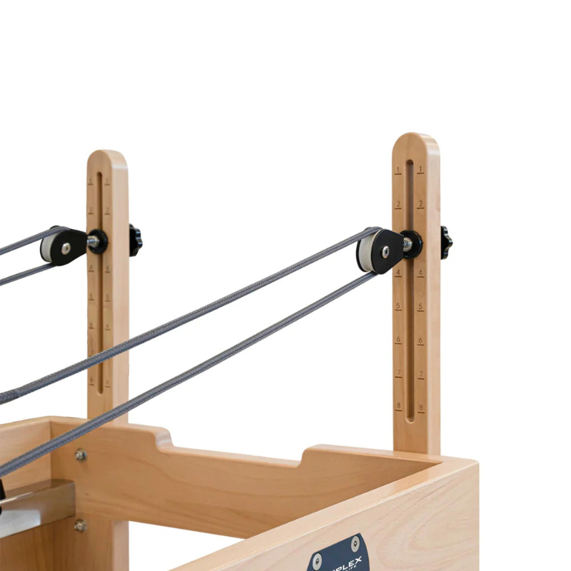 Angled side view of the pulleys on Reeplex Luna Beechwood Pilates Reformer