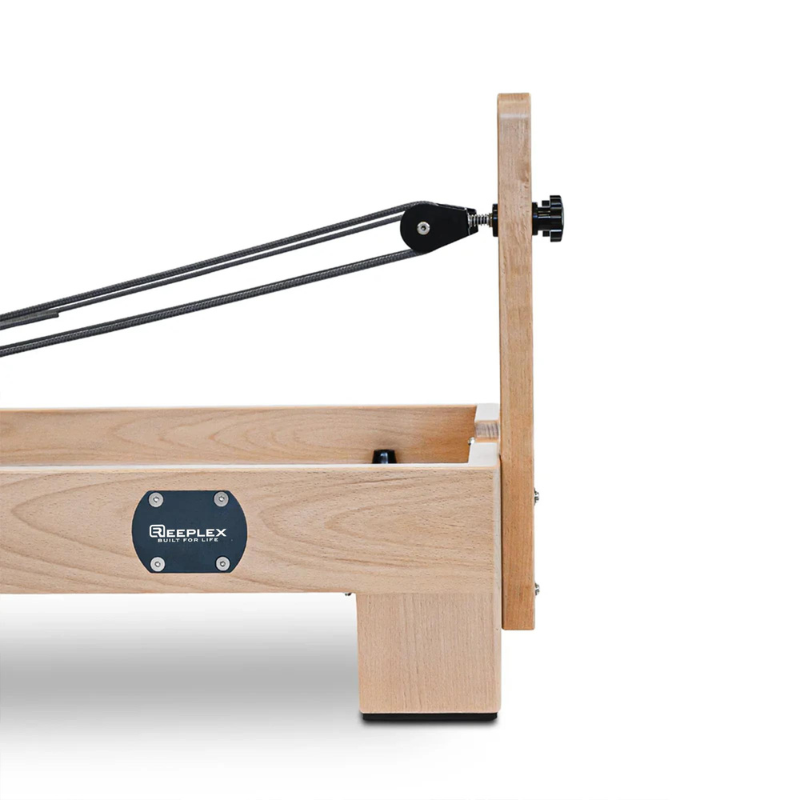 Side view of the pulleys on the Reeplex Luna Beechwood Pilates Reformer