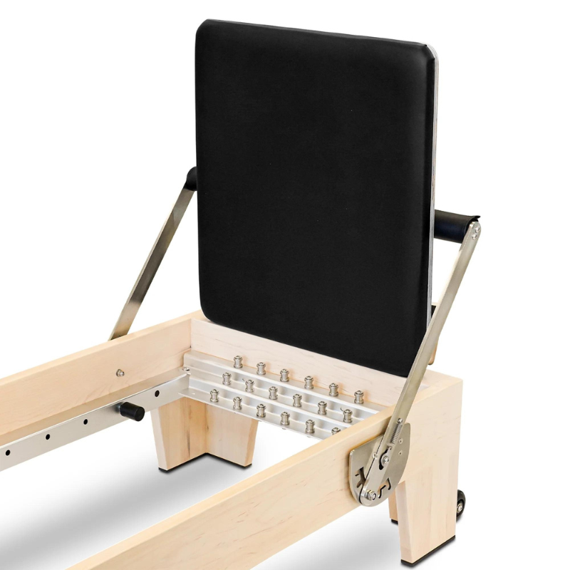 Close-up shot of the jump board on the Reeplex Pilates Reformer Pro Maple Wood with Half Trapeze Tower