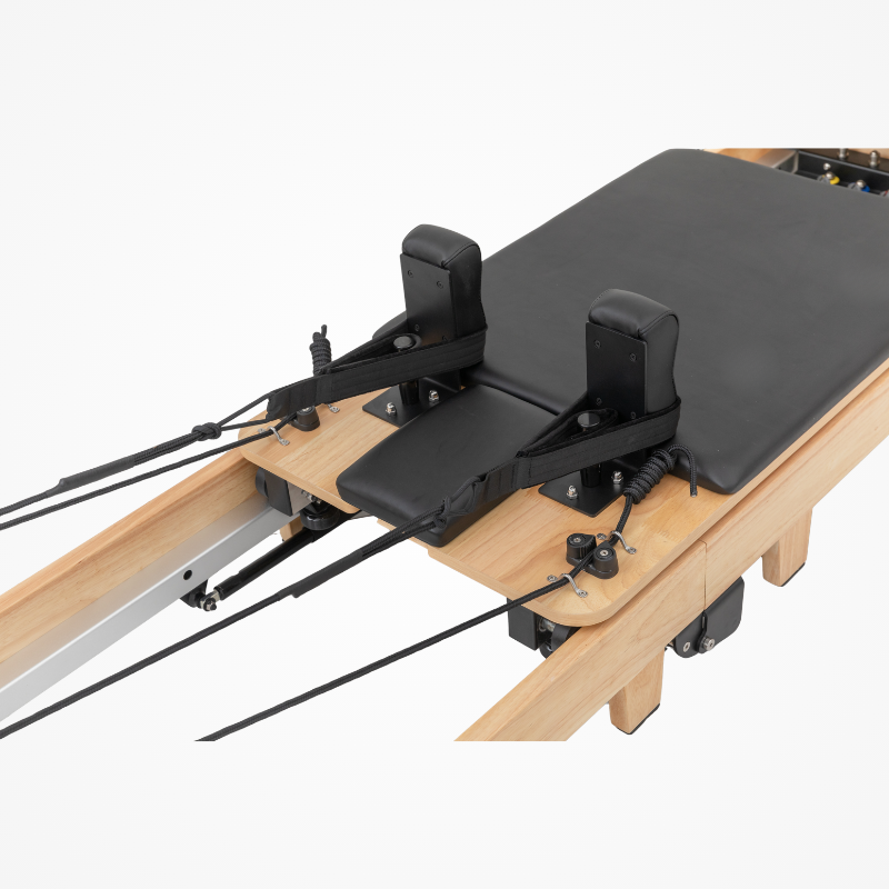 Back view of the carriage bed and shoulder blocks on Reformys Cloud Foldable Pilates Reformer in Black