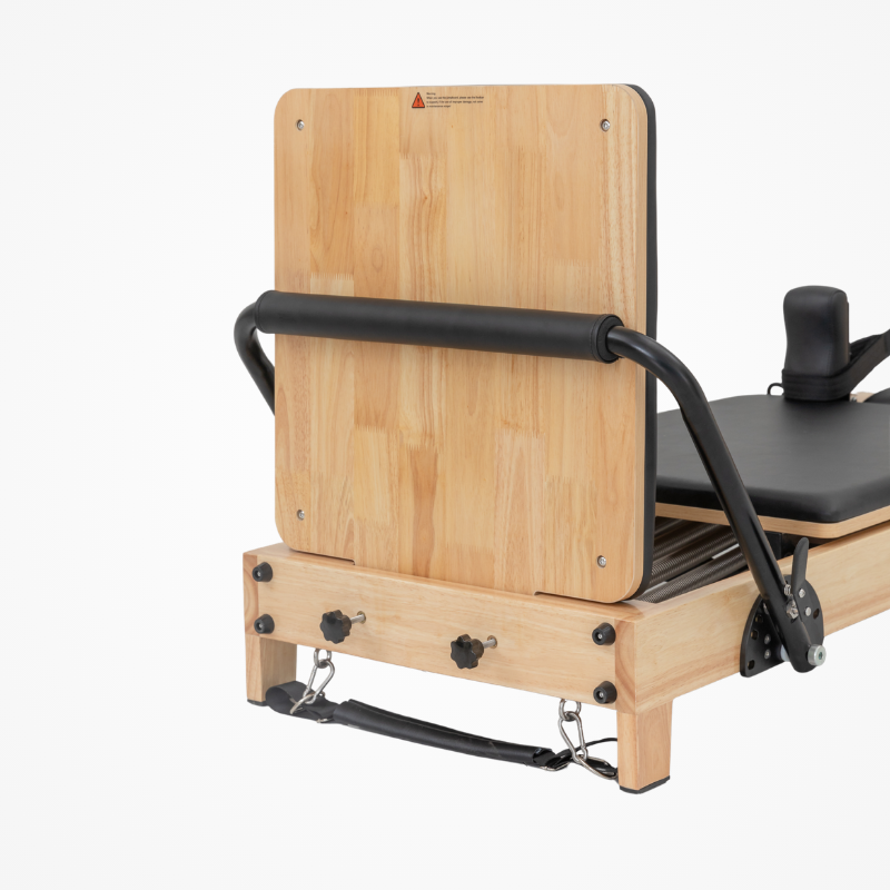 Front view with footbar and jumpboard on Reformys Cloud Foldable Pilates Reformer in Black