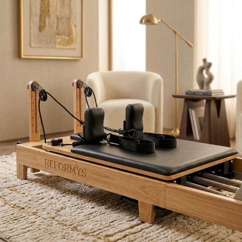 Close-up of carriage of Reformys Cloud Hydraulic-Assisted Folding Pilates Reformer Machine in Black inside a home lounge