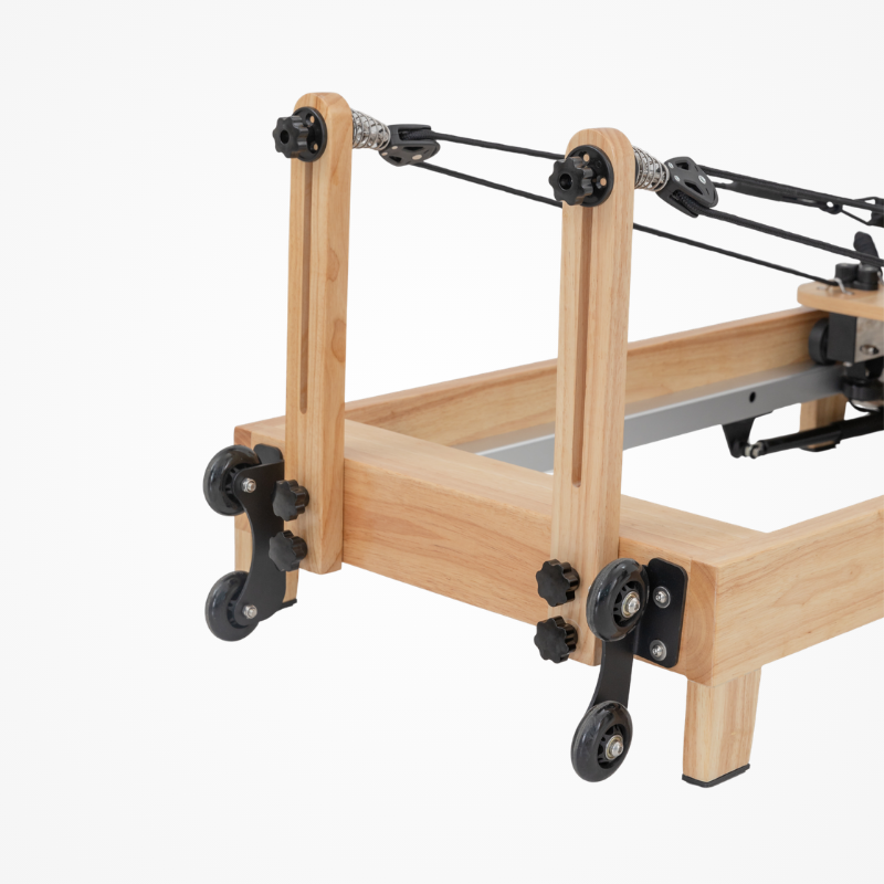 Angled back view of the pulley risers on Reformys Cloud Folding Pilates Reformer Machine