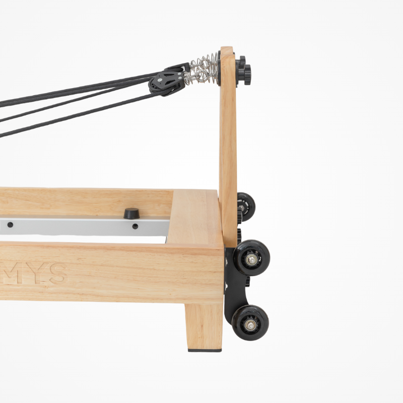 Side view of the pulley risers on Reformys Cloud Folding Pilates Reformer in Black