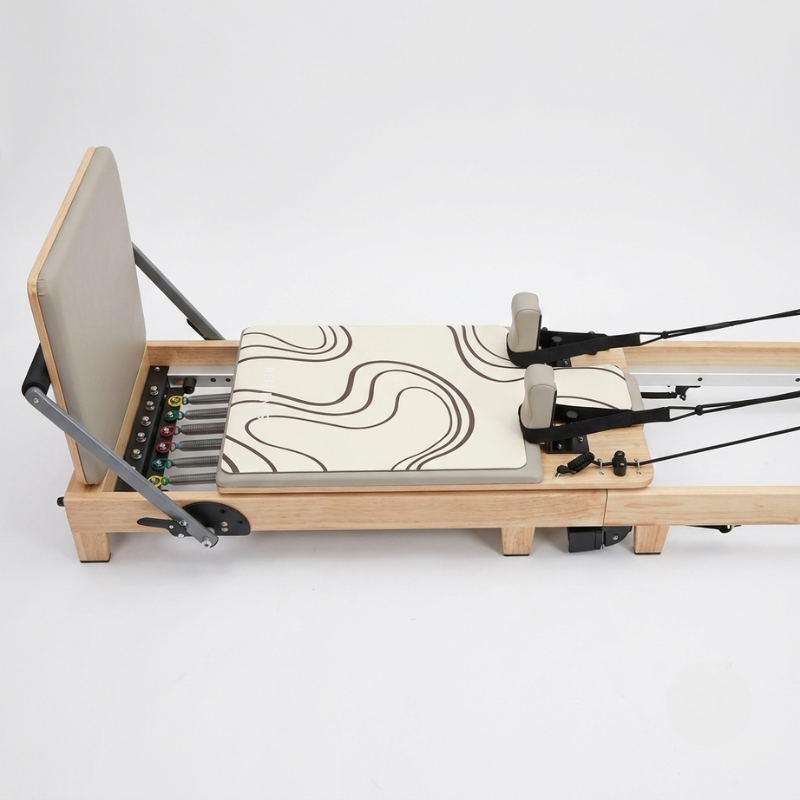 Reformys Pilates Reformer Mat in Contour on a reformer Pilates machine with white background