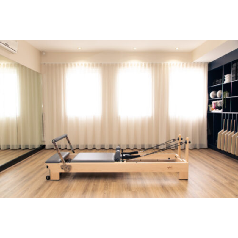 Volt Q2 Maple Wood Studio Pilates Reformer in a studio