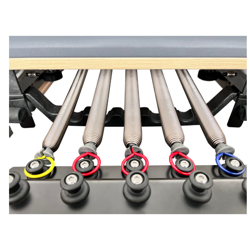 Close-up of springs on Volt Q2 Maple Wood Studio Pilates Reformer