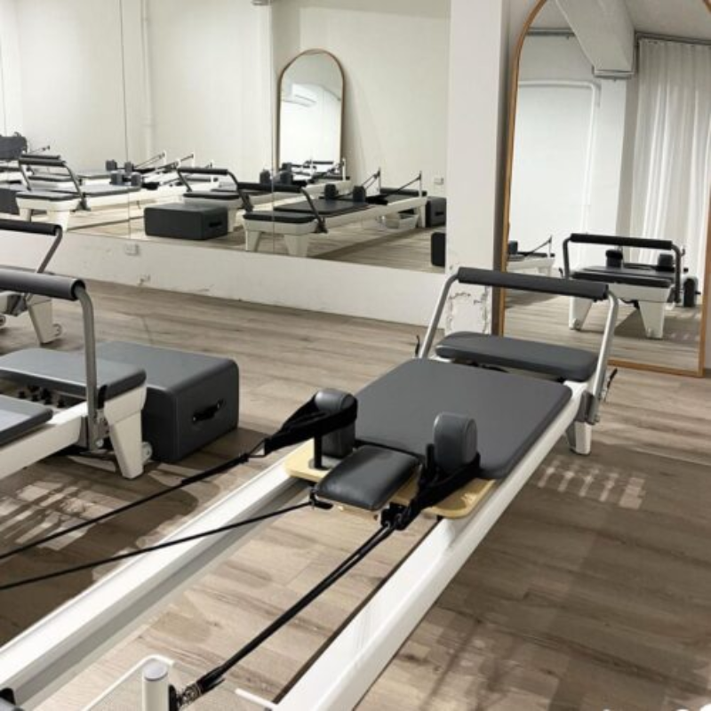 Volt V9 Studio Pilates Reformer in a studio by a mirror wall